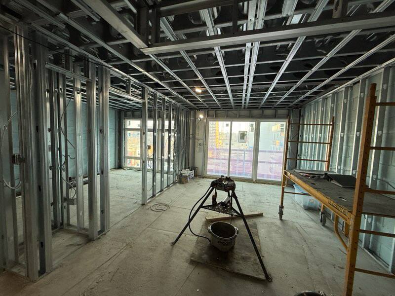 Steel-framed apartment interior at rough-in stage