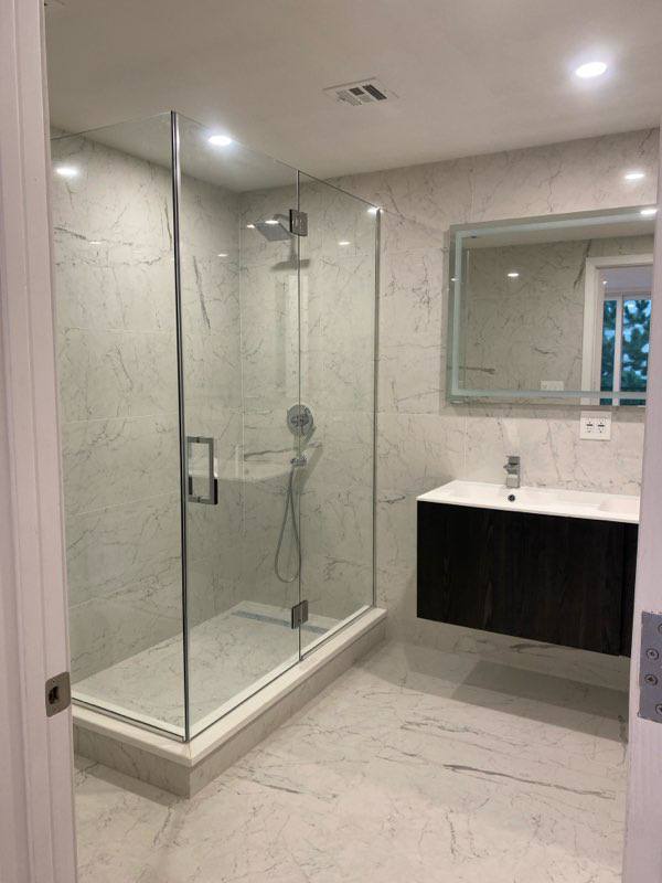 Calacatta book-matched bath with walnut vanity