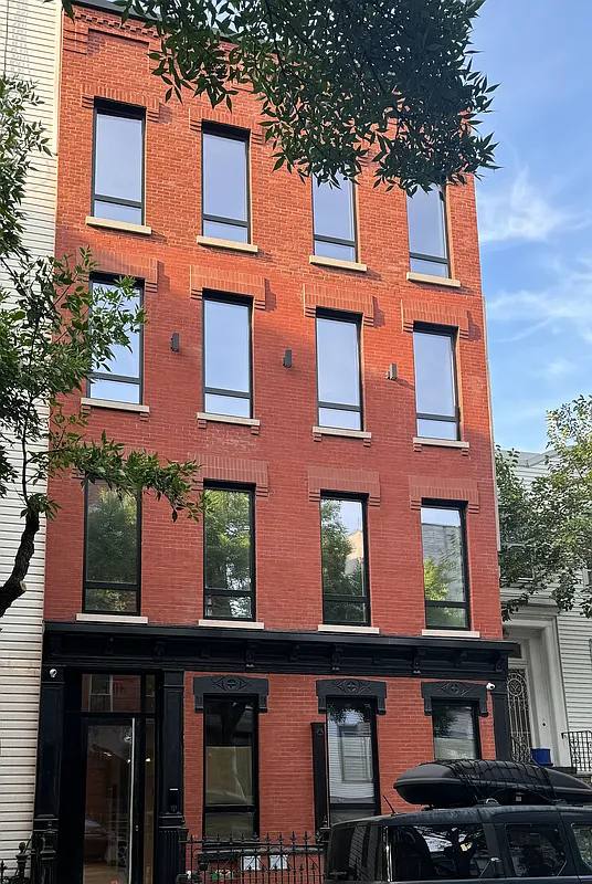 Red brick townhouse with corbel detailing