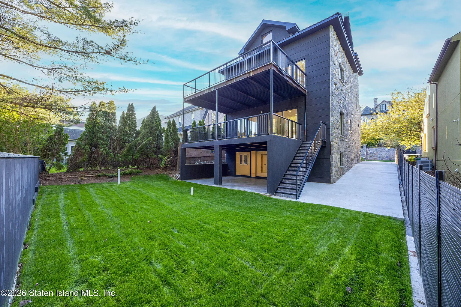Stone & Black-Clad Residence with Steel Decks