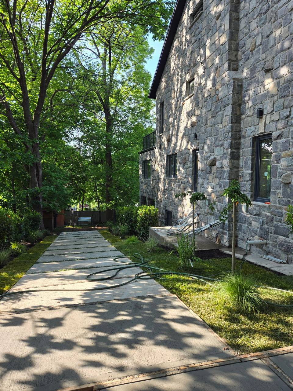 Cut-stone walkway and landscape